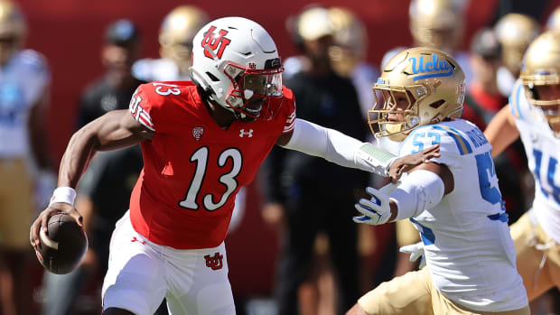 Sep 23, 2023; Salt Lake City, Utah, USA; Utah Utes quarterback Nate Johnson (13) is chased by UCLA Bruins linebacker Darius Muasau (53) in the first quarter at Rice-Eccles Stadium. Mandatory Credit: Rob Gray-USA TODAY Sports